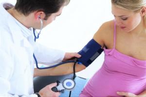 Why does blood pressure increase before and after childbirth?